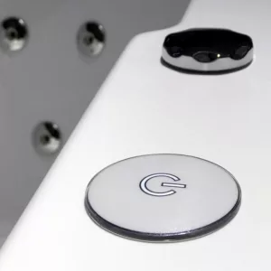 Baignoire balnéo d'angle pour deux personnes, mesurant 150 x 150 cm, de la collection IMASSAGE, avec un système combiné Eau et Air, disponible à l'achat et à la livraison.